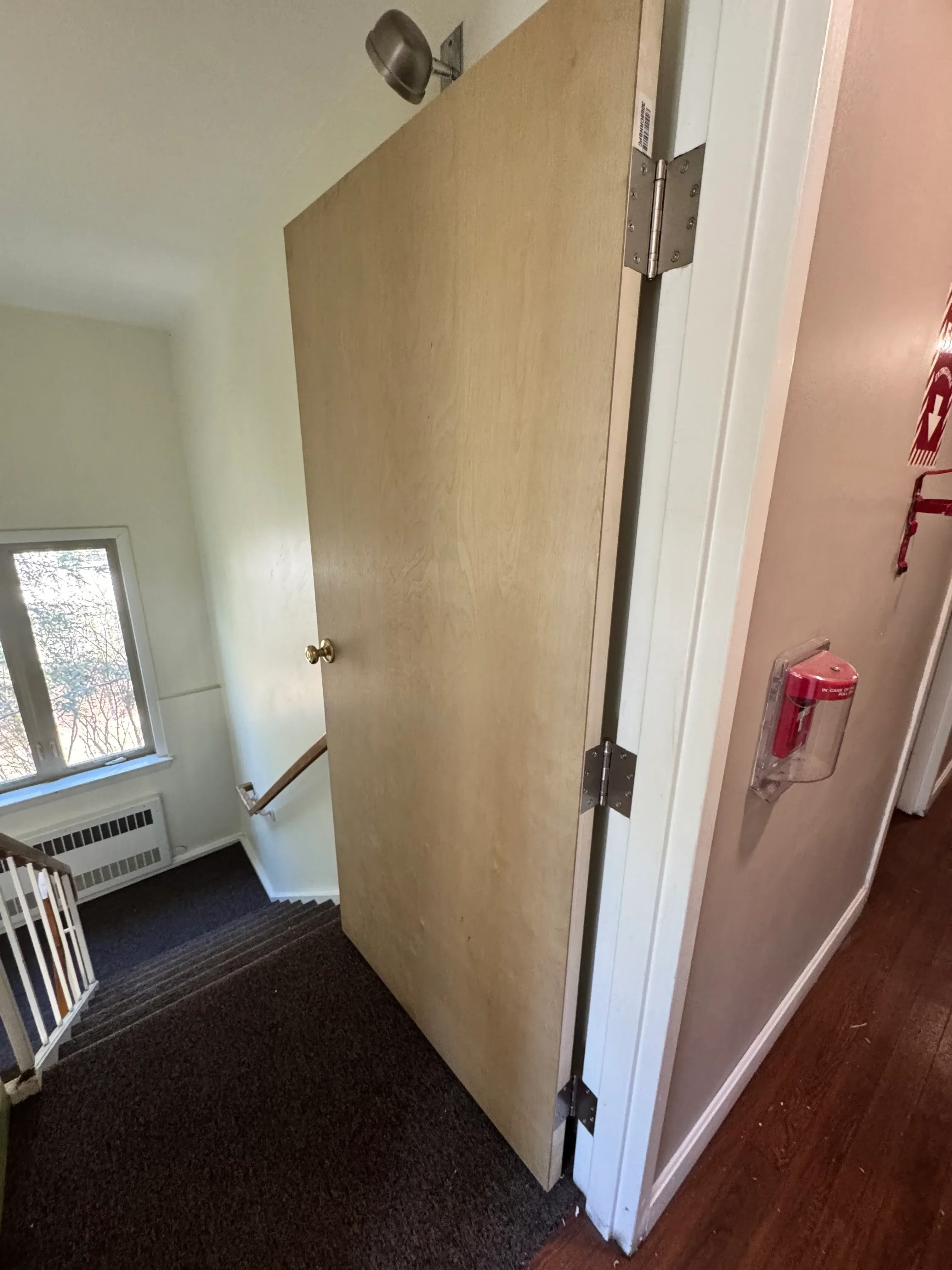 Coffered ceiling with white trim, recessed panels, and metal brackets installed in residential room