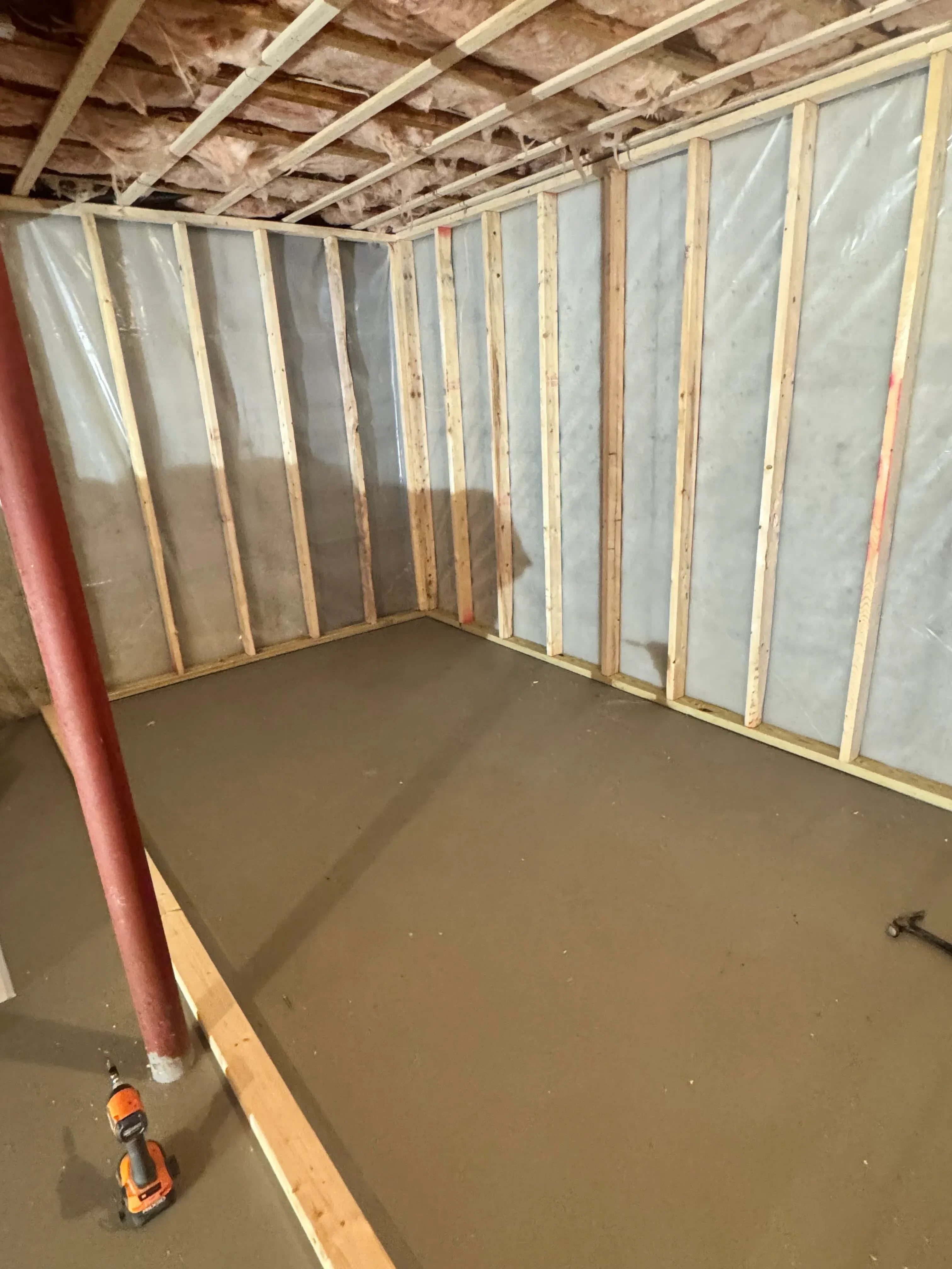Wooden ceiling joists with vapor barrier and drywall substrate installation